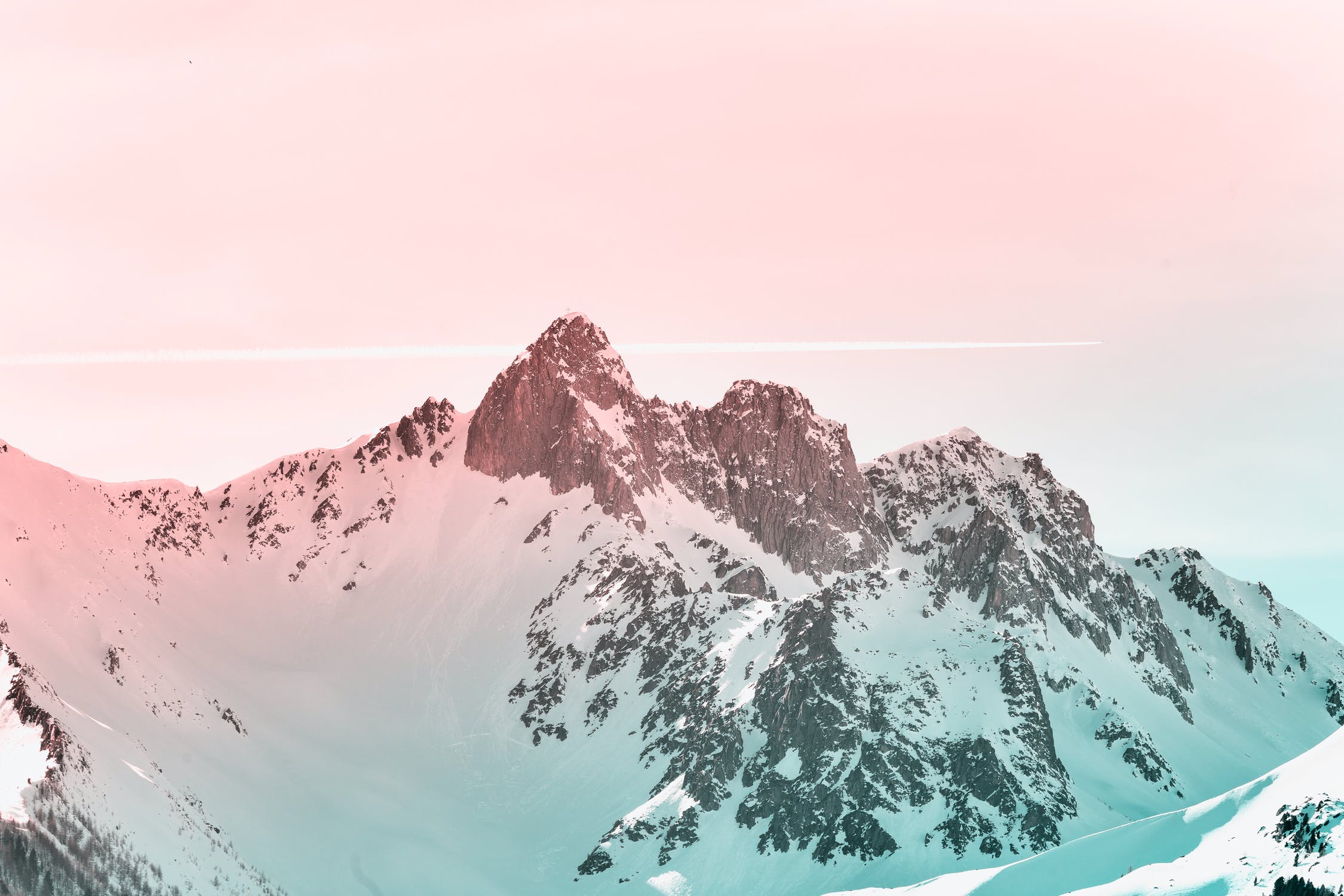 Snowy summit beneath a pink sky